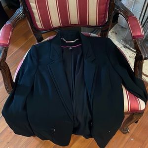 Black blazer, suit jacket, WHBM size 4. Machine washable, 100% Polyester.